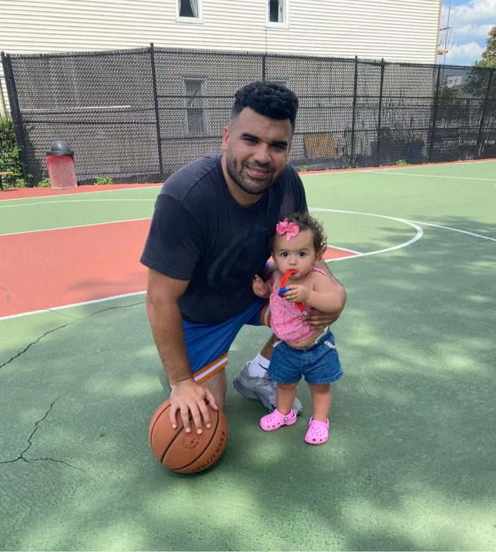 Jordan with his daughter on the basketball court
