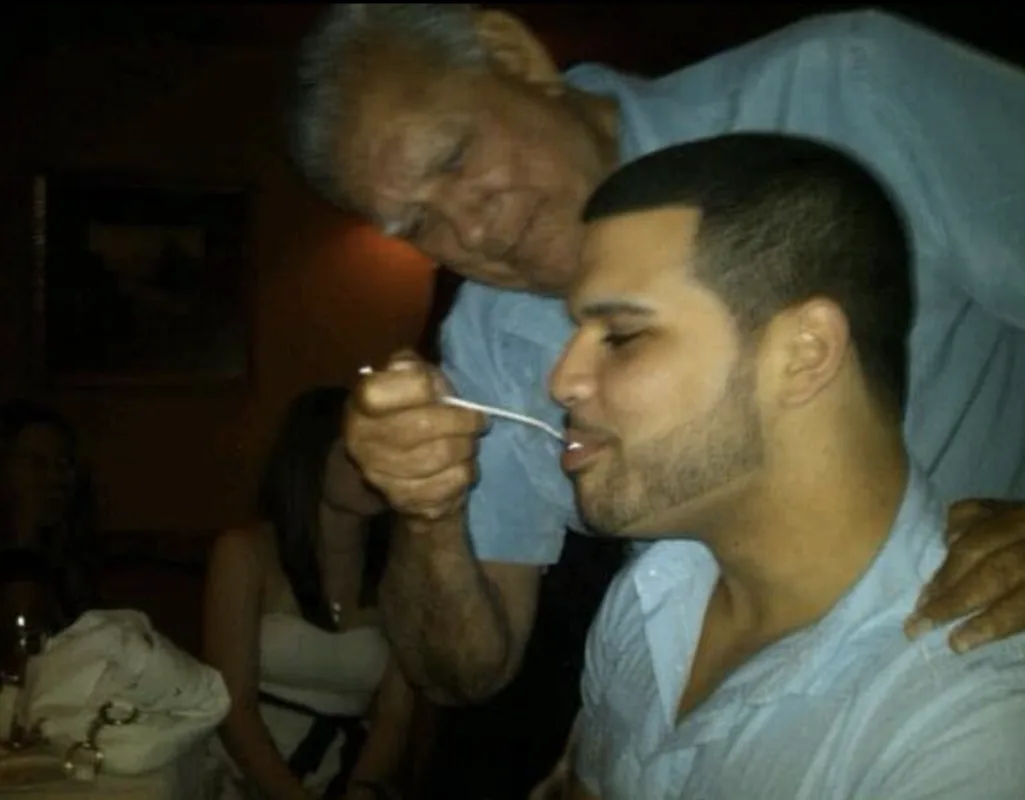 Jordan's grandfather sharing a bite at dinner